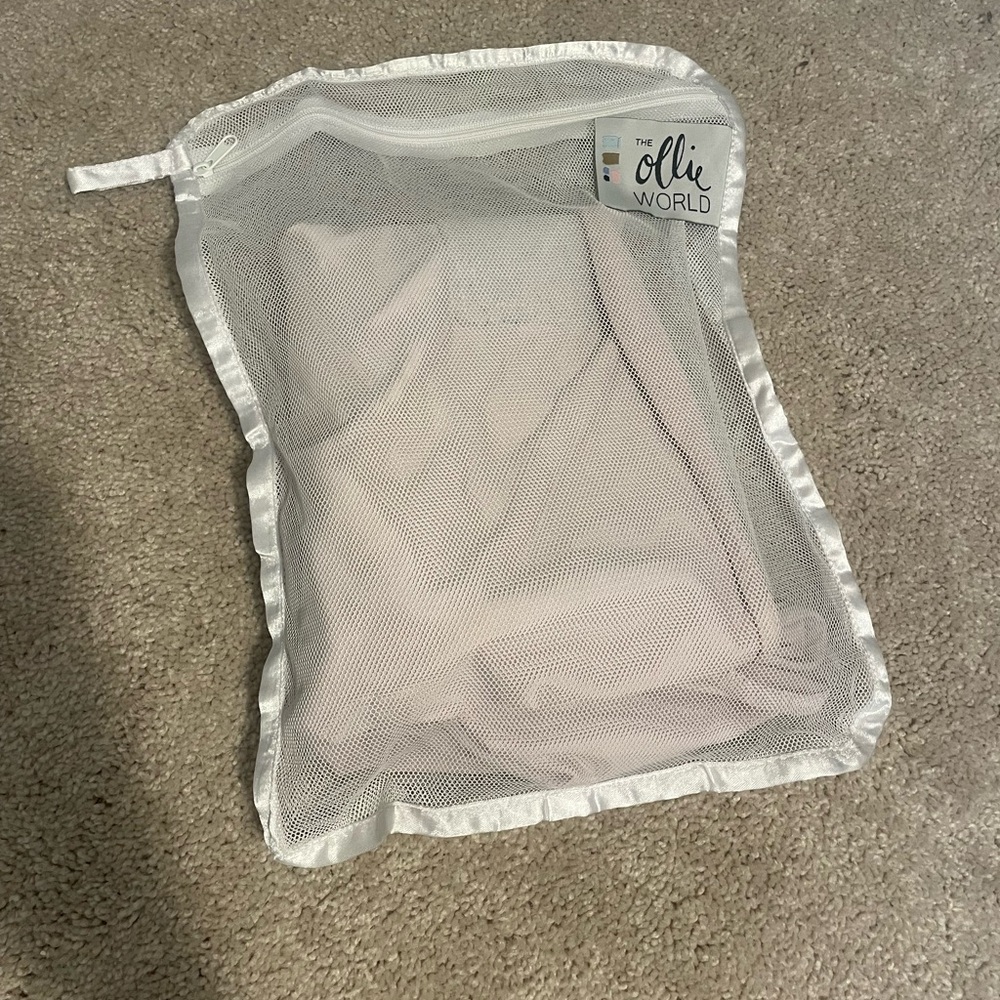 Pink ollie swaddle with laundry bag